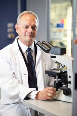 Laureate Professor John Aitken in a research lab