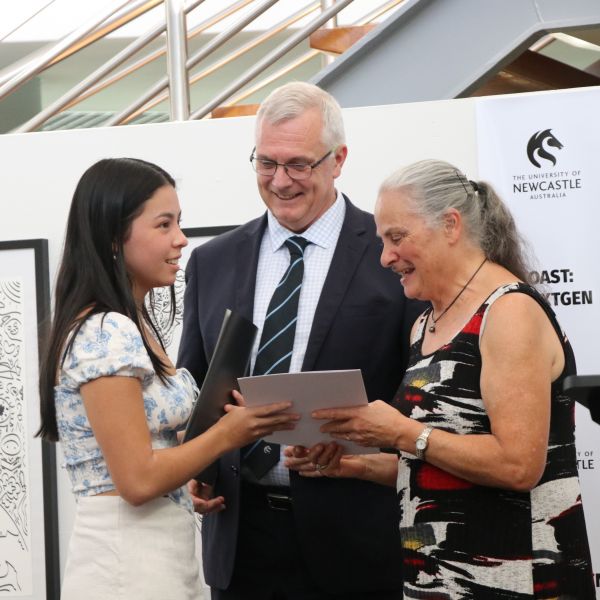 Vivi Clements Lee receives the University Art Collection Acquisitive award from Aunty Bronwyn Chambers and Professor Mark Hoffman