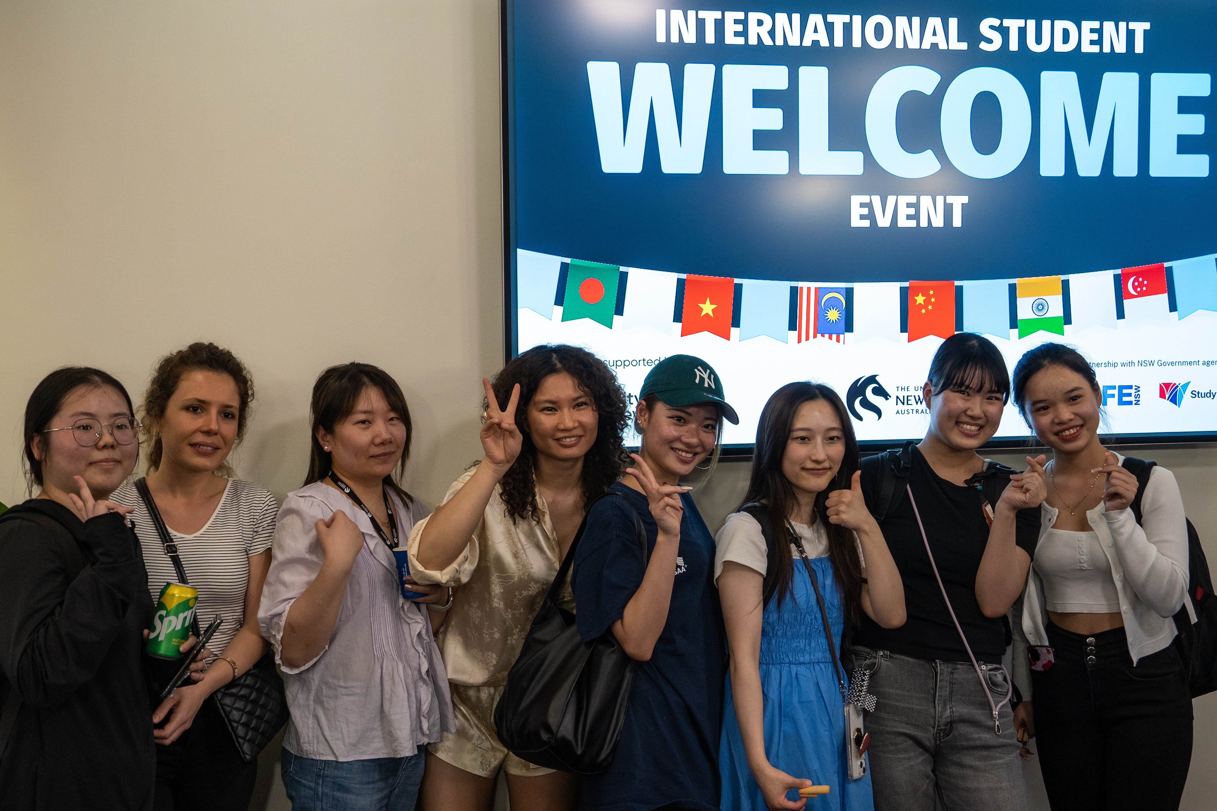 A group of 8 international students smiling