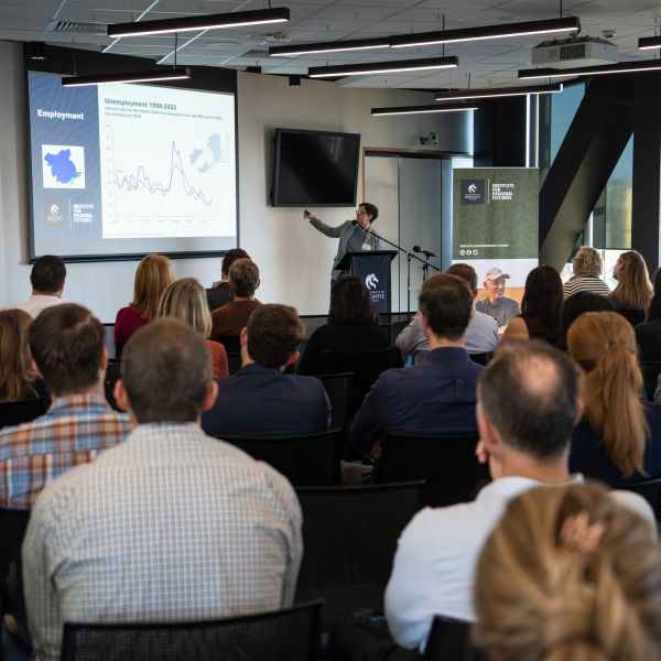 Ms Amanda Wetzel points at graph on screen during her presentation. Rethink needed on Hunter’s economic development priorities