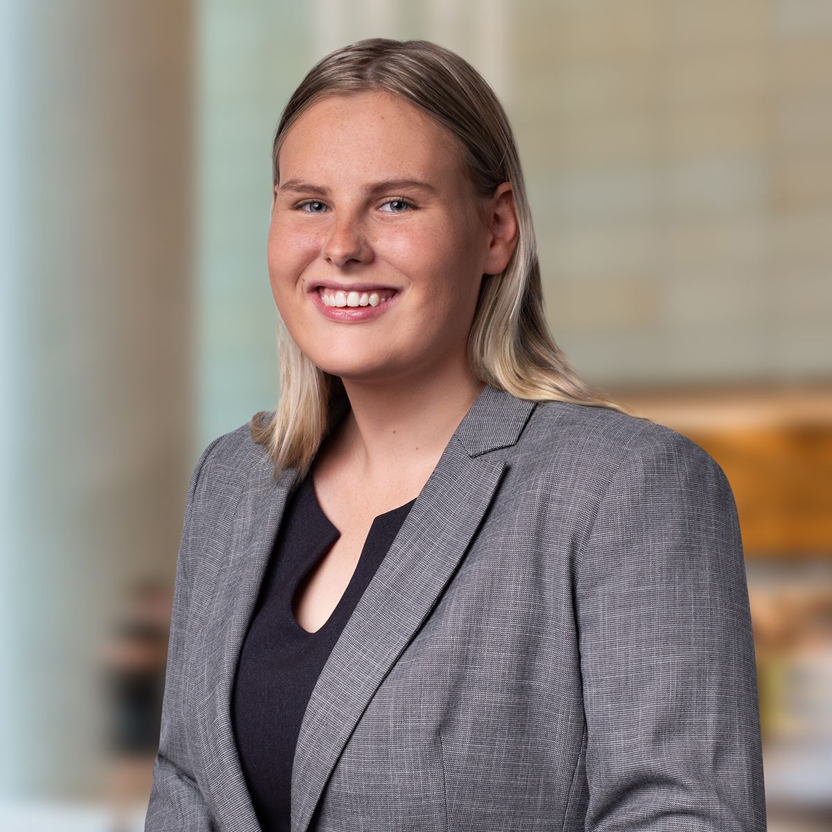 Lindsay Thomson in a grey blazer smiling
