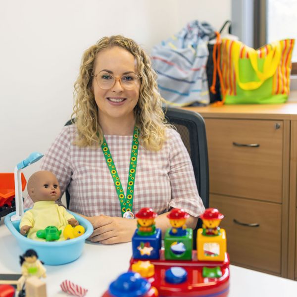 Olivia Whalen Olivia Whalen at her lab desk with children's toys