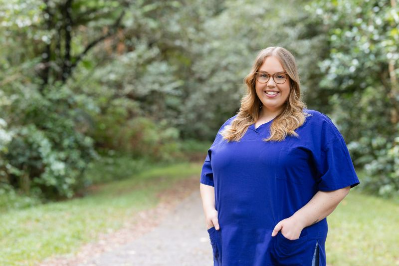 Dr Emily Mason Gamilaroi woman and surgeon, Dr Emily Mason, pictured in blue scrubs.