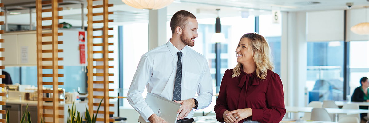 Two students walk side by side