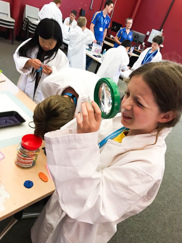 Student with magnifying glass