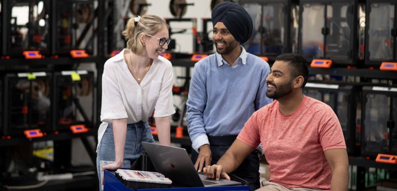 Students smiling at each other