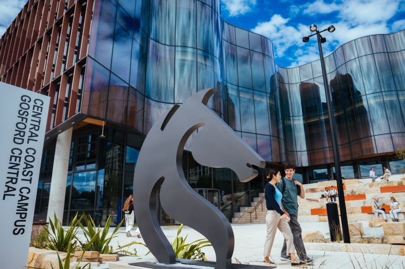 Students walk past the new Gosford Central Building on Mann St Gosford