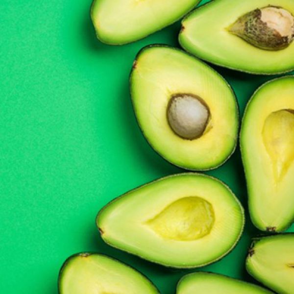A collection of avocados cut in half