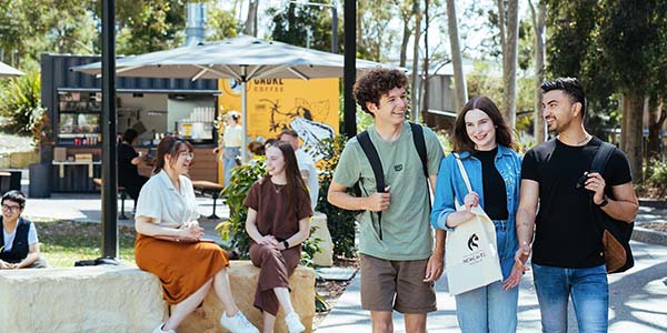 A group of students walking around university