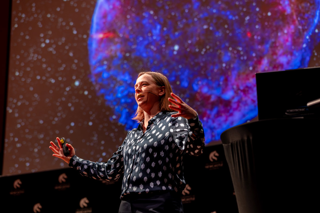 Lisa Harvey Smith with space planet behind her