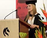 Graduate Ginny Gallegos delivering a graduation speech