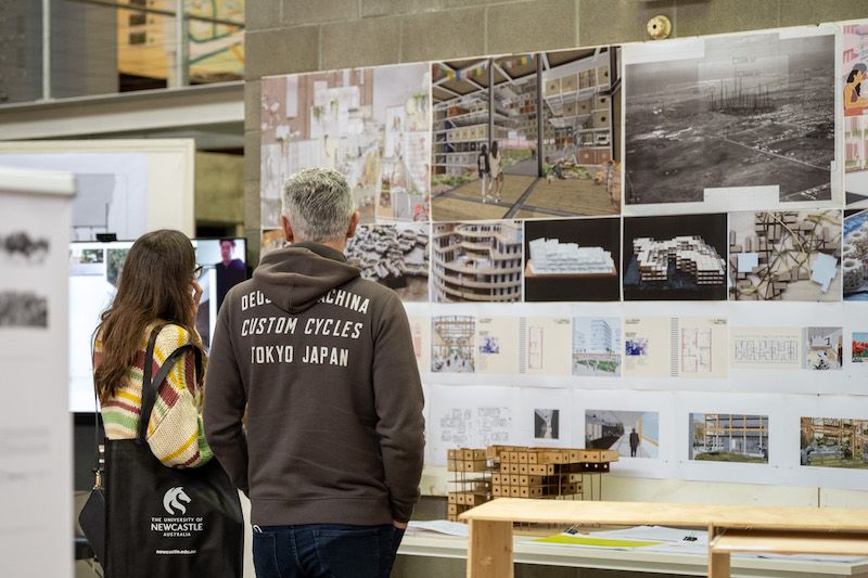 People looking at student work