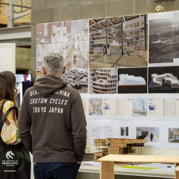 People looking at student work