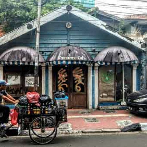 Mobilities Image Romance Cafe with man riding bike infront