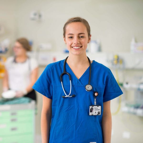 Medical student standing in medical centre with stethoscope. Excellence through Equity Pathway to Medicine: Creating opportunities for students from a variety of backgrounds.