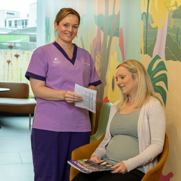 A midwifery student helping a patient 