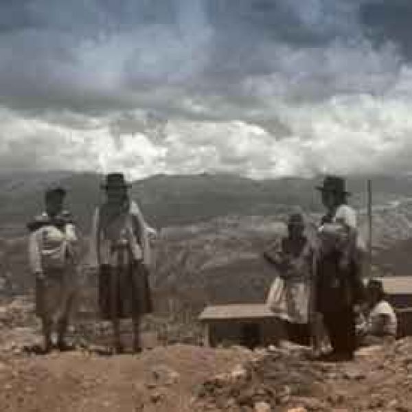 Ethnographic film film cover, peruvian locals standing in front of scenic mountain terrain