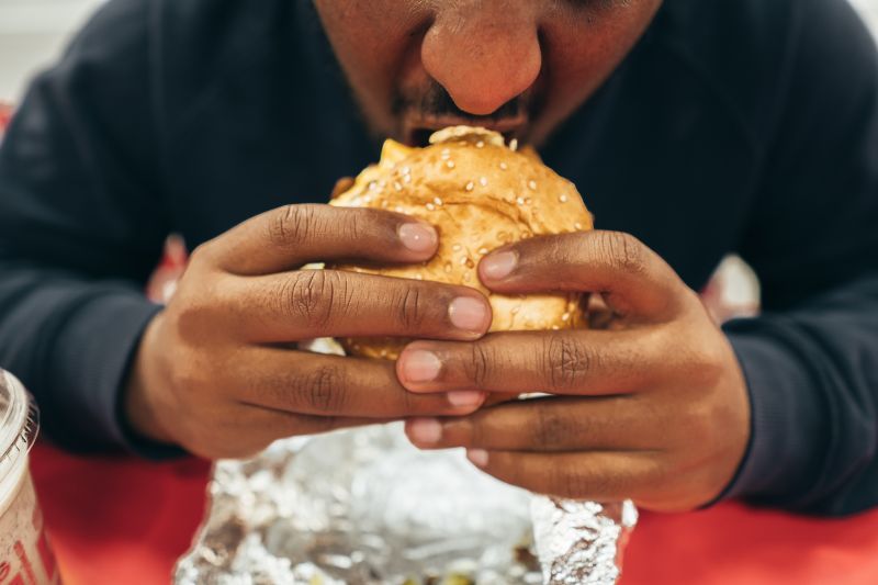 Person eating burger