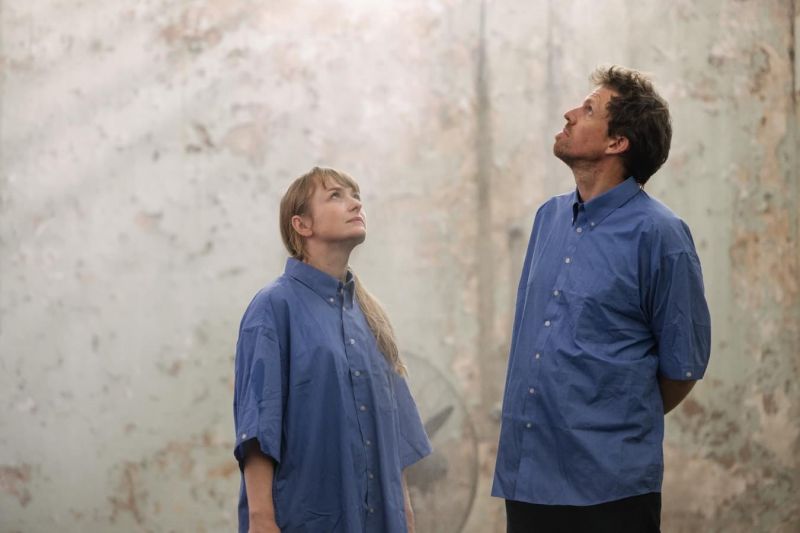 Heidi Axelson and Hugo Moline stand together, looking up