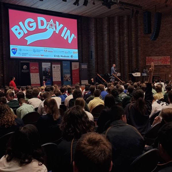 High school students sit in the Great Hall, watching a presentation from industry at BiG Day In