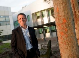 Research in action Neil Spratt in front of offices