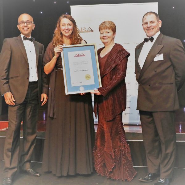 UON accepts ARA award. Annual Report wins Gold