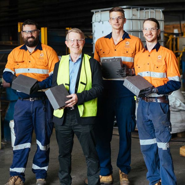 Shaun Nay, Erich Kisi, Mark Copus and Dominic McAtamney holding MGA Thermal bricks. MGA Thermal wins AFR Higher Education Award for research commercialisation