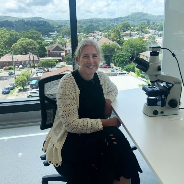 researcher sitting at desk with medical equipment. Inaugural NSW Women in Surgery Leadership award announced