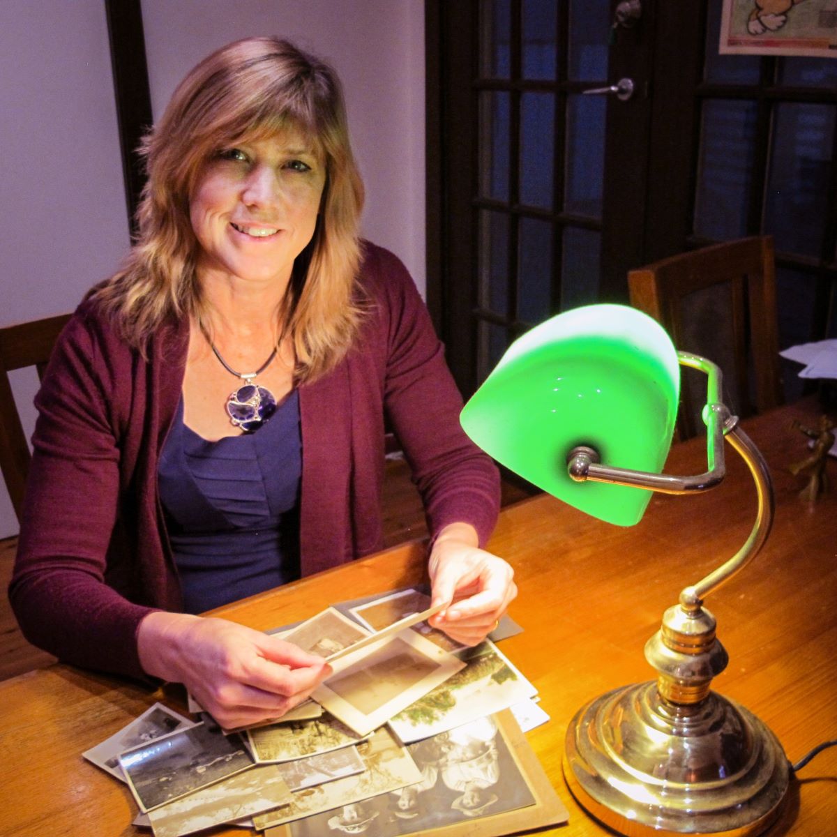 Professor Victoria Haskins sitting at a desk.