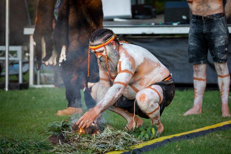 Worimi man, Justin Ridgeway takes part in the smoking ceremony.