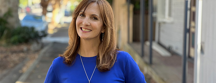 Juanita Todd in front of a computer