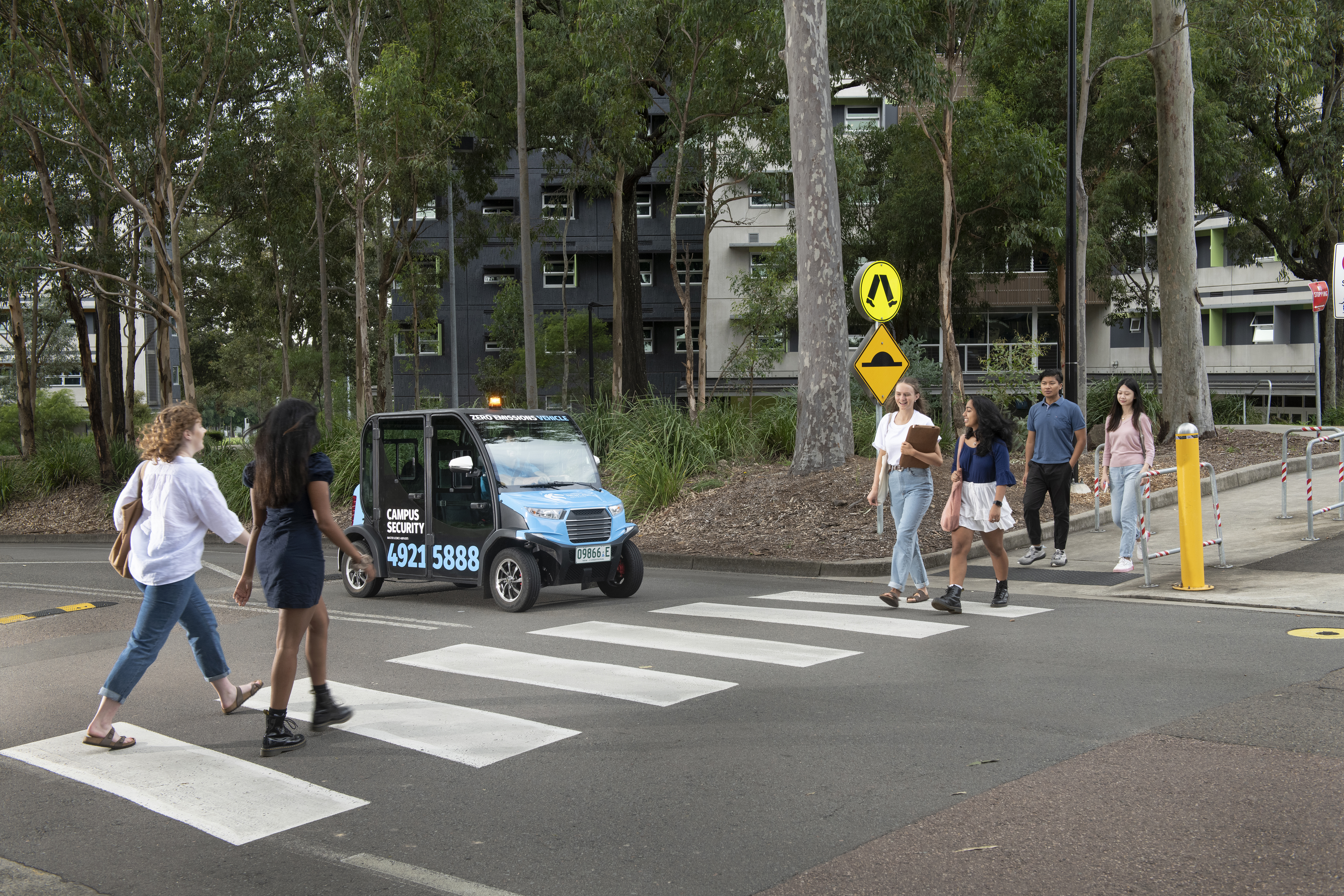 Students walking across pedestrian crossing