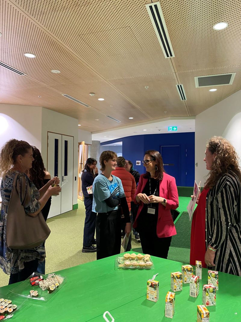 Students discussing climate policy ideas with Trisha Doyle