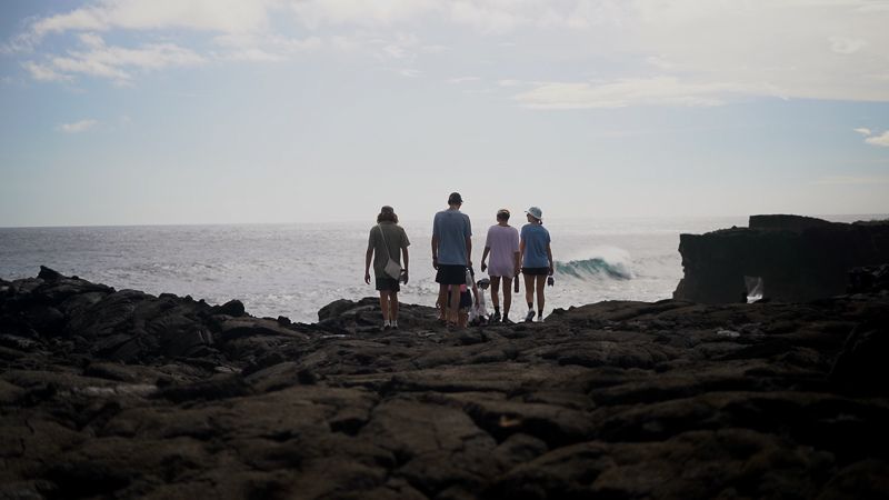 a group of students admiring the vast coastline of Samoa