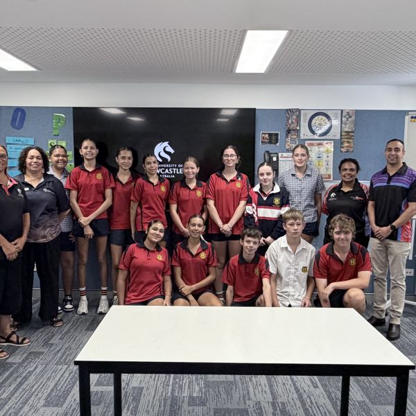 Group of Wollotuka staff with high school students smiling. Wollotuka Recruitment Takes Outreach Across the Regions.
