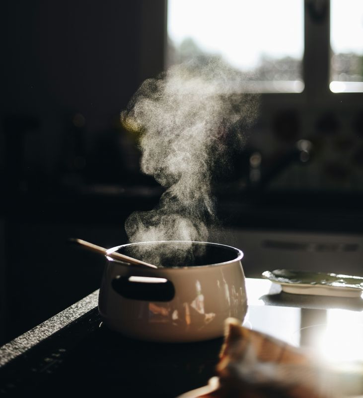 Saucepan heating milk on a stove top