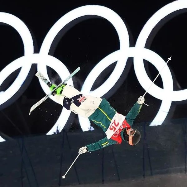 Matt Graham skiing at Beijin Olympics in front of olympic rings. - Monday 22 June 2026