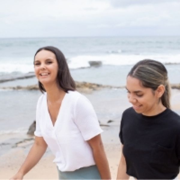 Students on beach. WIMBA Scholarships Inspire Female Leaders