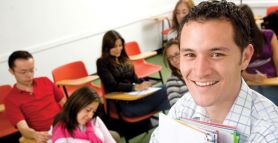 OHS lecturer in learning environment with students. University of Newcastle joins ranks of elite OHS education providers