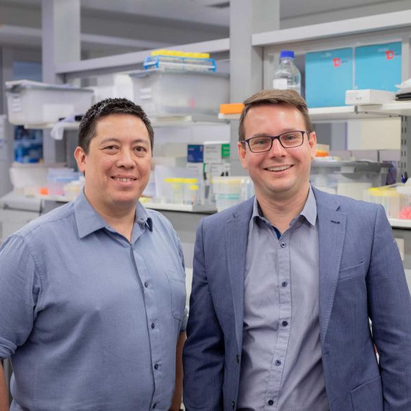 Image of Dr Kaiko and Dr Keely wearing grey button up shirts in a lab. Research equipment is out of focus in the background.Image of Dr Kaiko and Dr Keely wearing grey button up shirts in a lab. Research equipment is out of focus in the background.  . AI driving breakthroughs in inflammatory bowel disease.