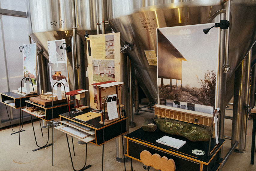 Project sit on tables beside brewing equipment