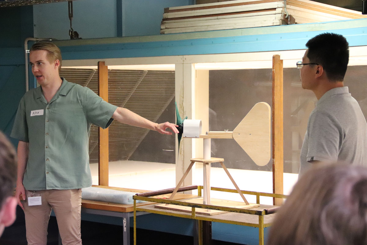 Academics demonstrate a windmill in a wind tunnel