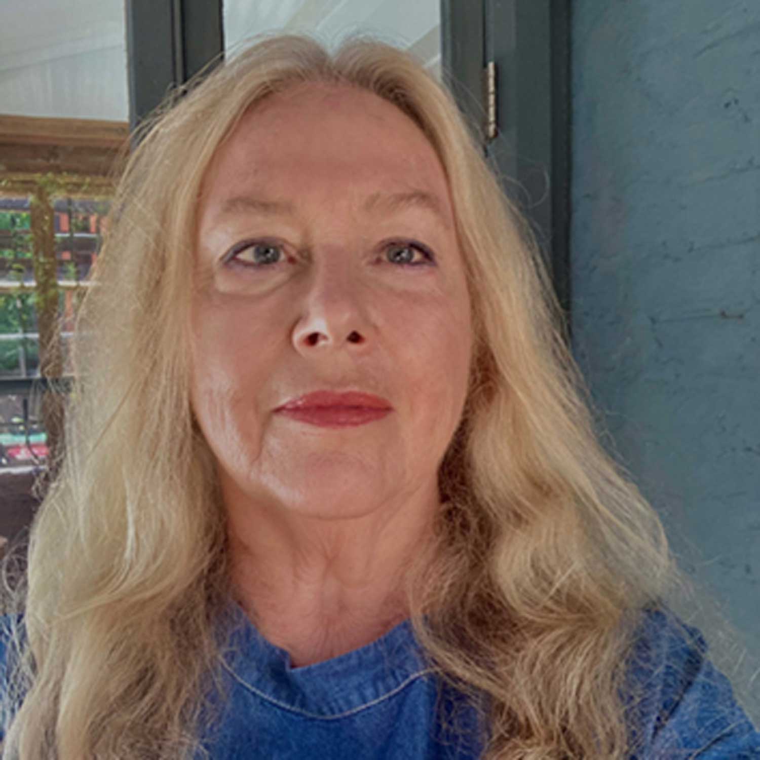 Blonde female looking at the camera