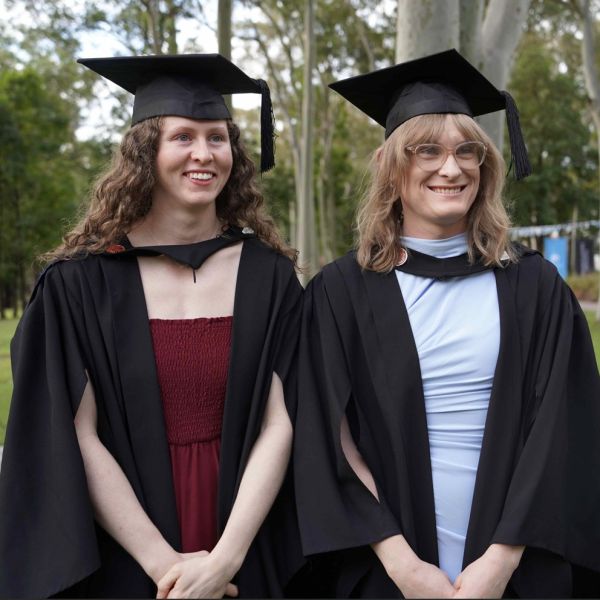 Haley and Sophie in the graduation gowns smiling. Women in engineering shine at University of Newcastle’s Callaghan graduation