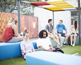 Students sitting on top of library studying. Eight projects boost equity at UON