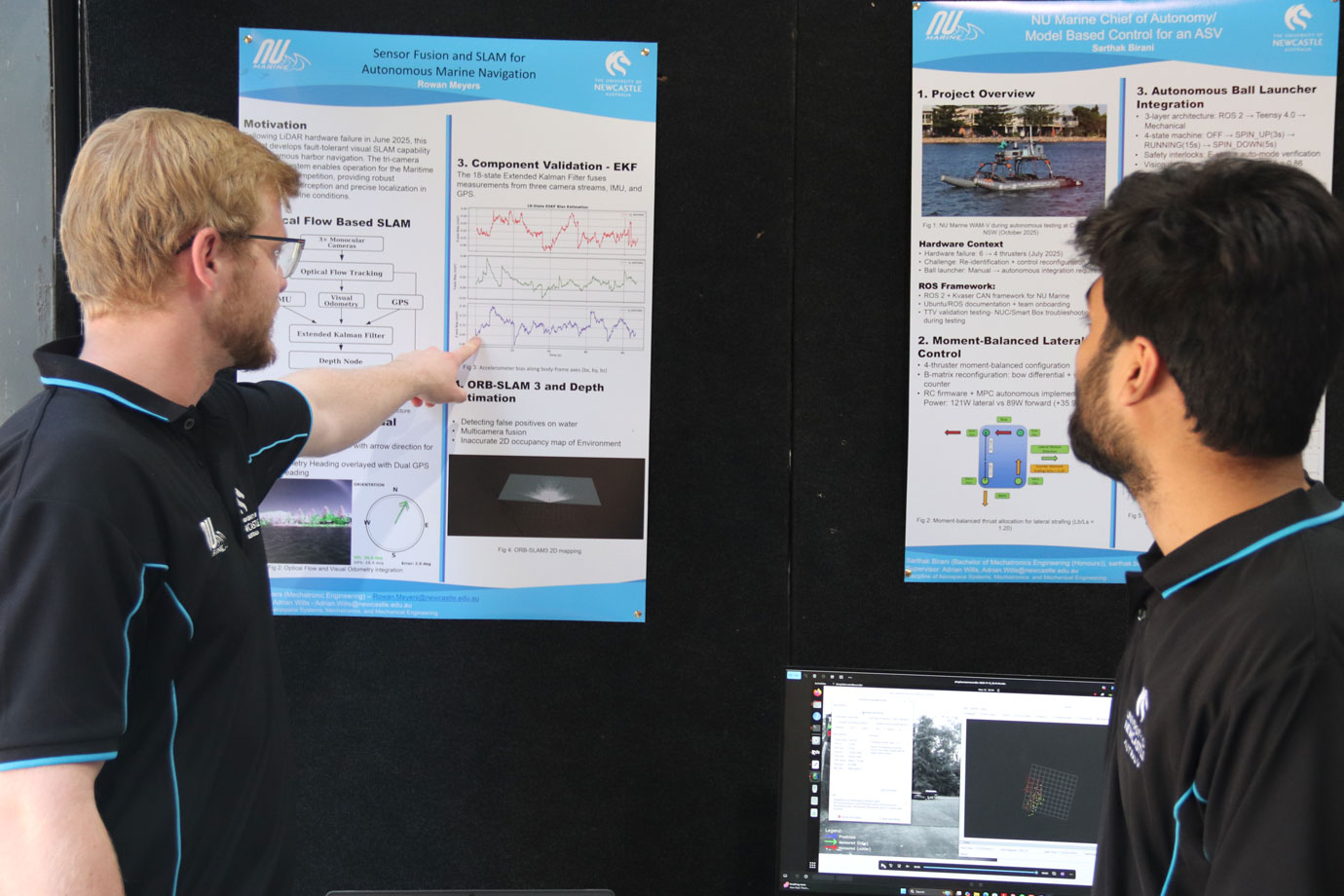 Two students look at a poster