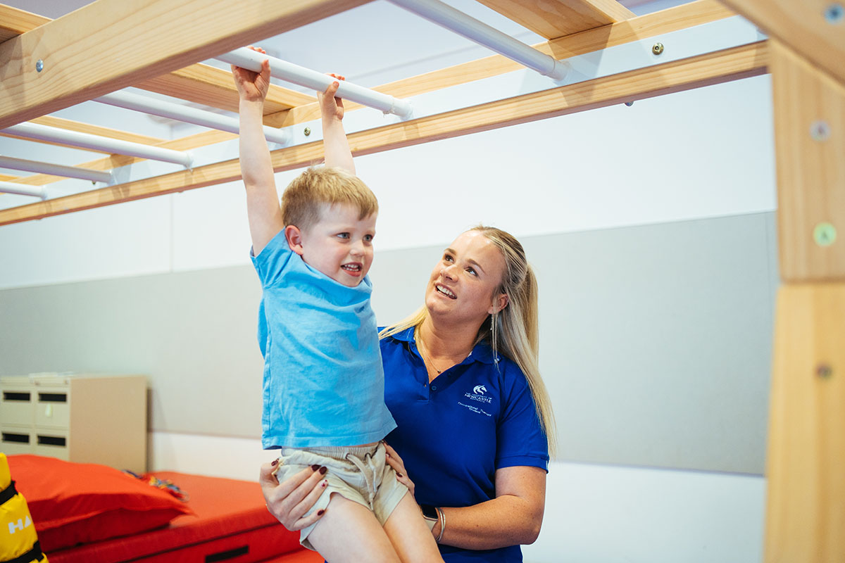 An occupational therapist helping a child