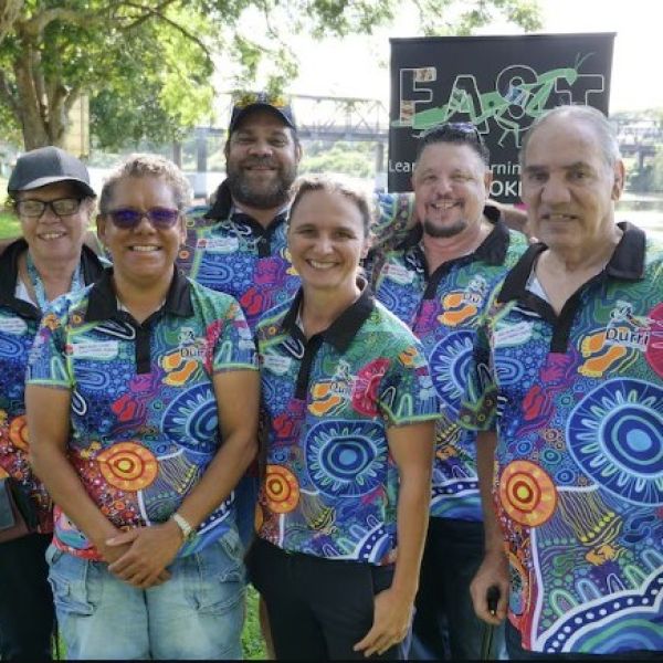 Three women and three men wearing matching polos with Indigenous artwork fabric, standing together and smiling for the camera. Culturally led research to improve Indigenous heart and stroke outcomes