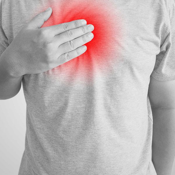 Person suffering heartburn. Confusion around treatment of digestive disorders