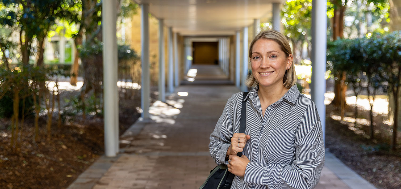 Student Gabi Donoghue smiling and standing outdoors